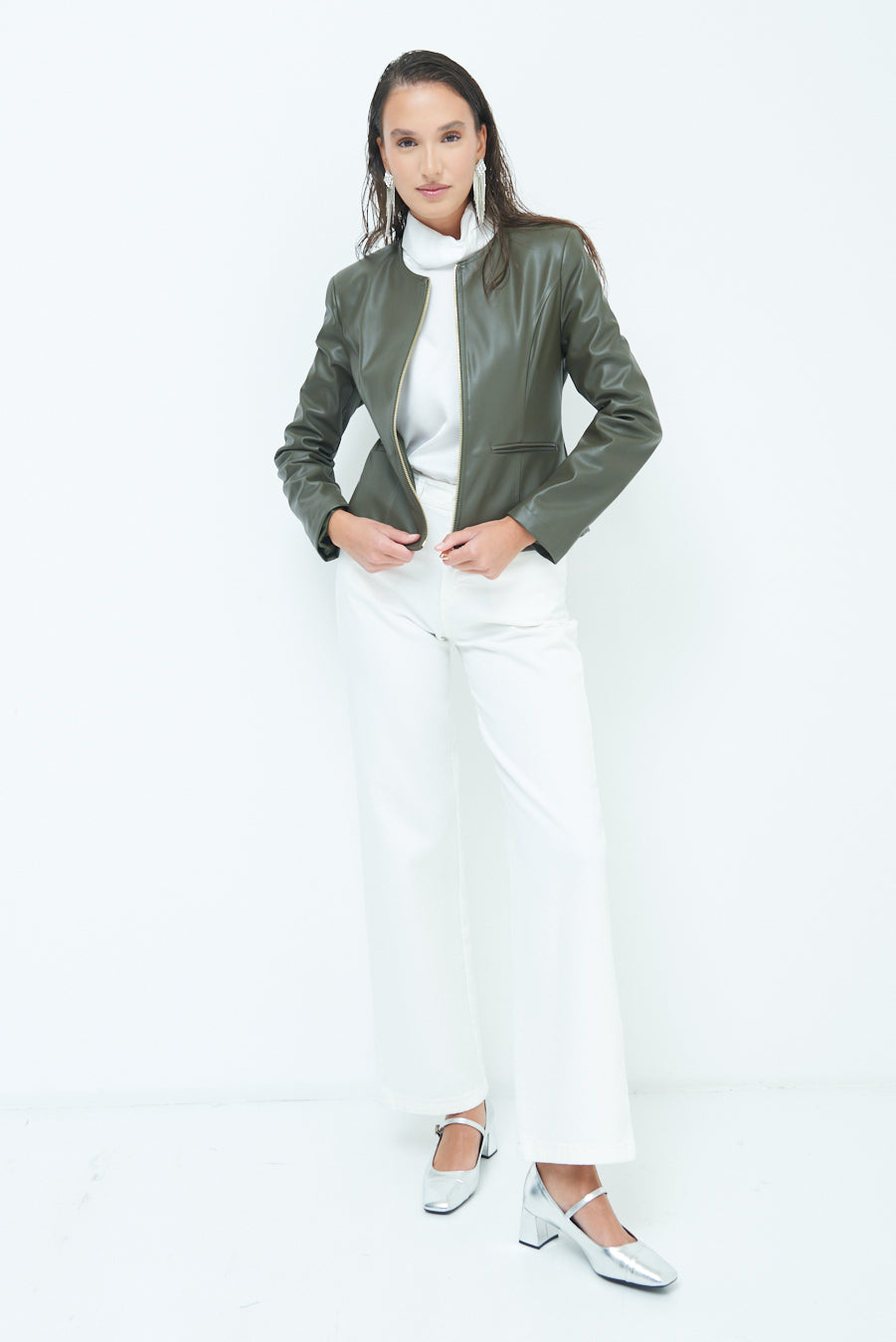 Woman in Sleek zip-up green leather jacket