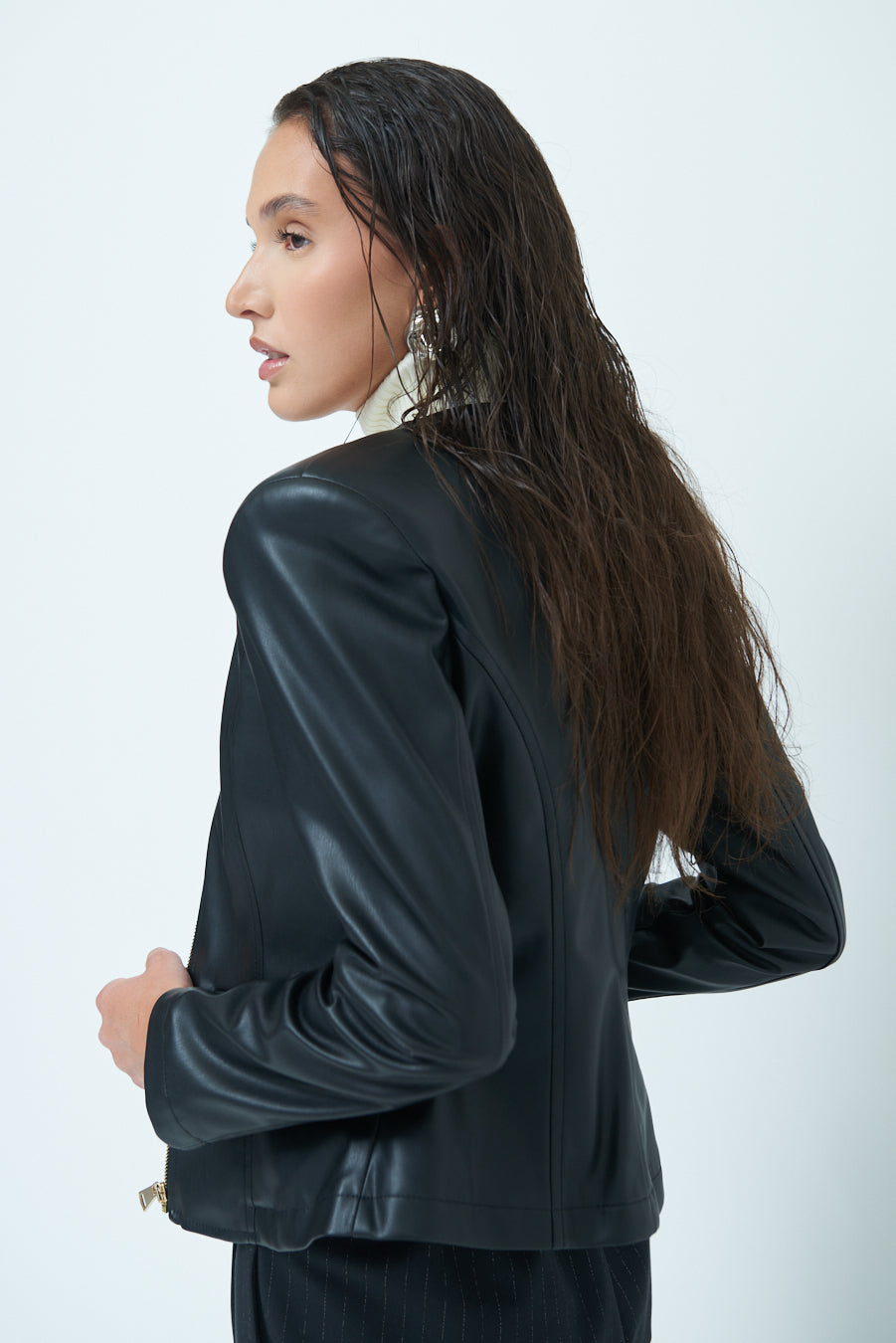 Woman in Sleek zip-up black leather jacket