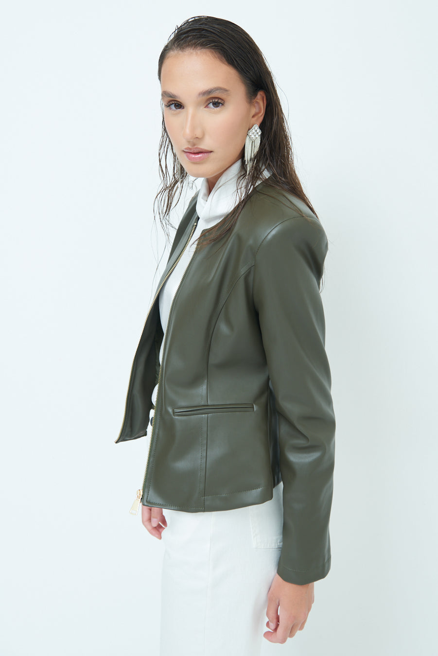 Woman in Sleek zip-up green leather jacket