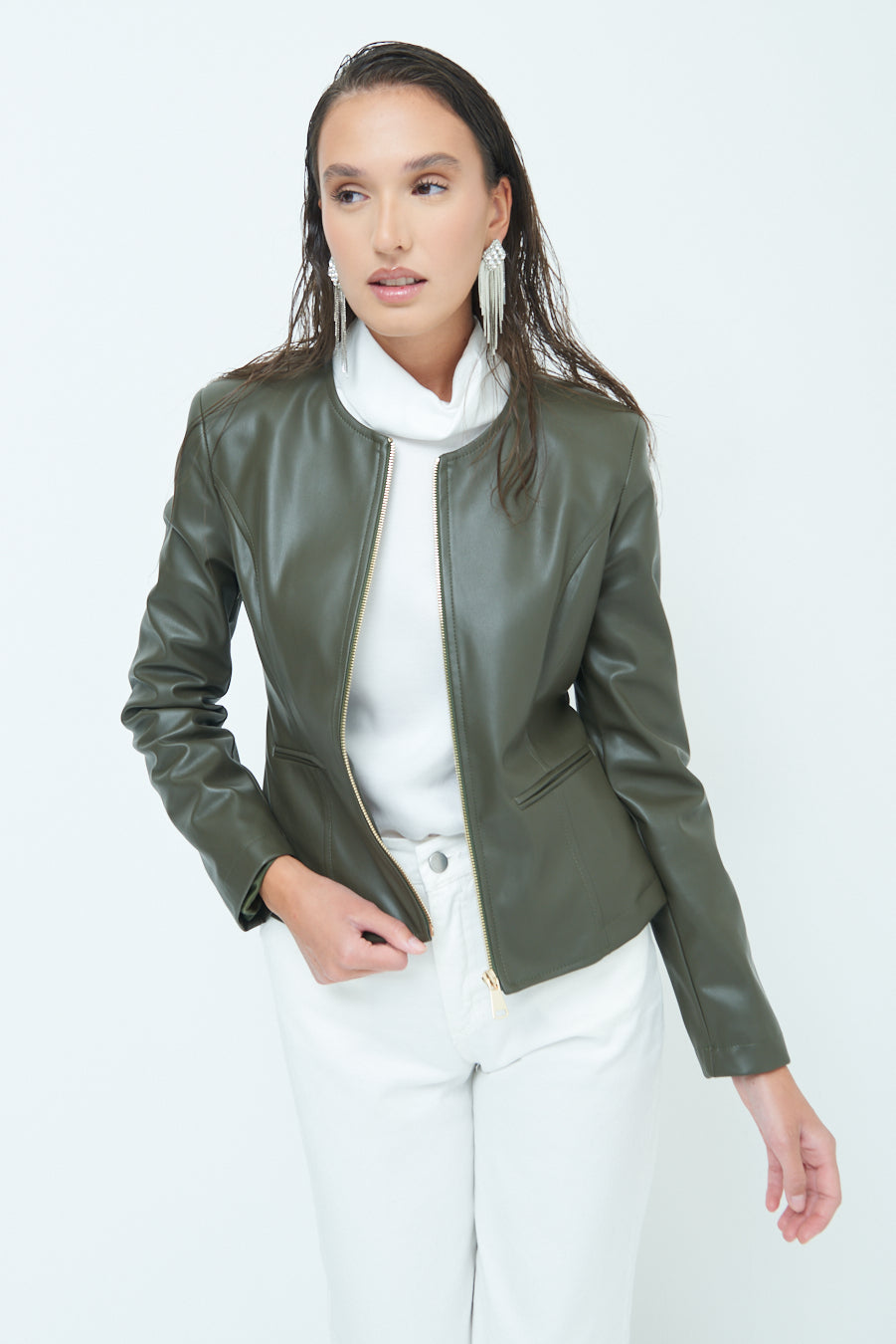 Woman in Sleek zip-up green leather jacket