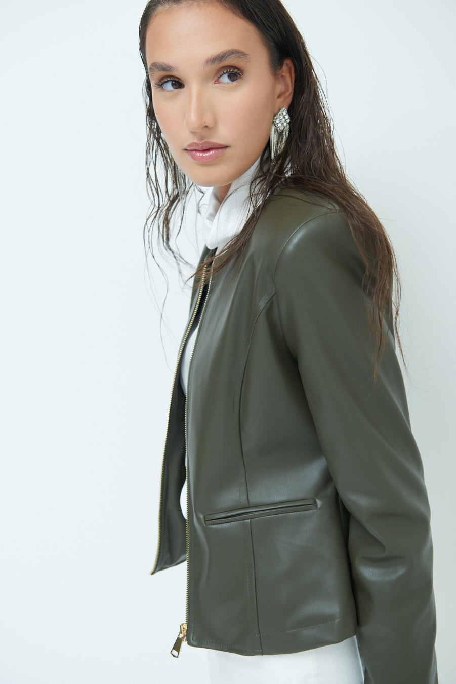 Woman  in Sleek zip-up green leather jacket