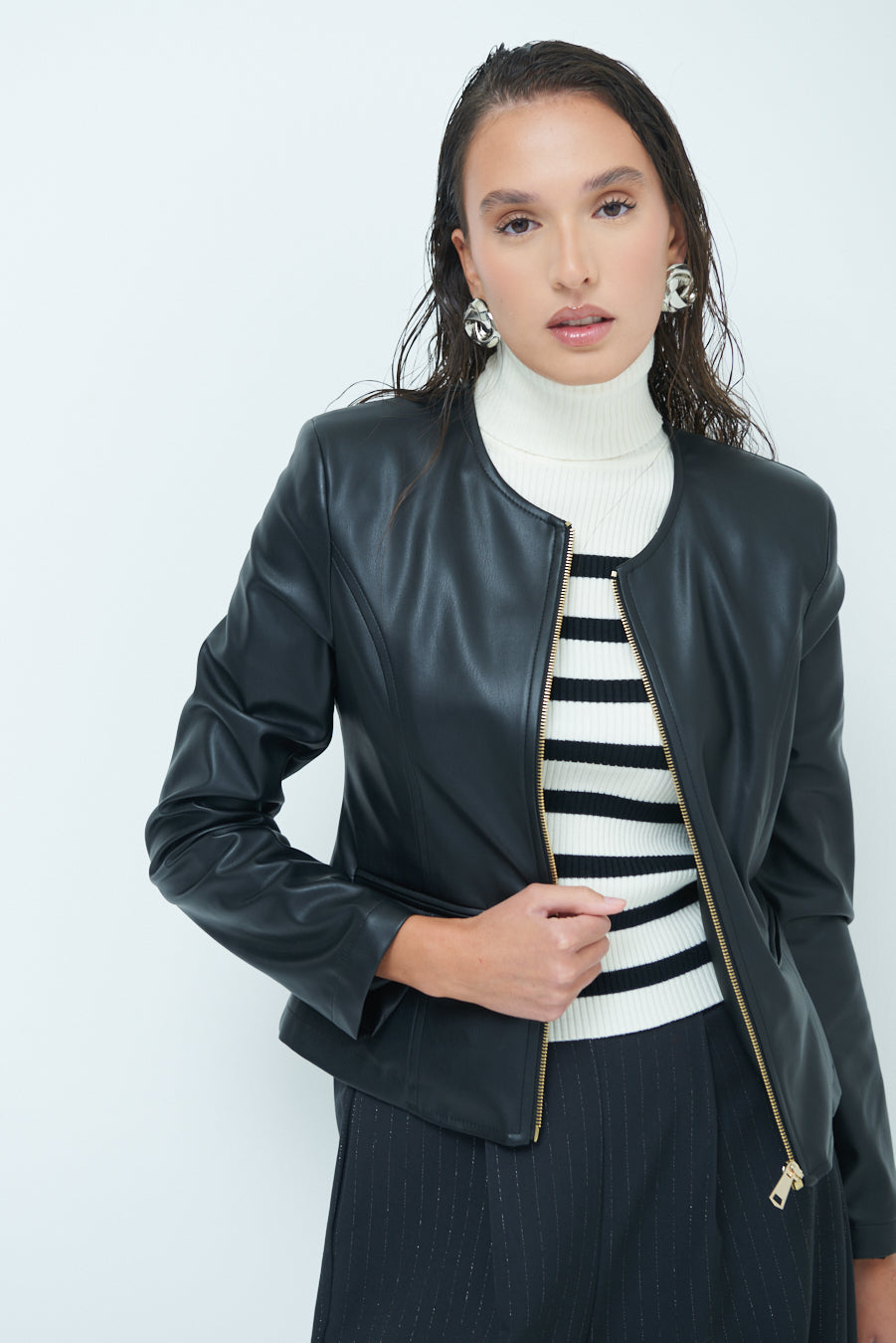 Woman  in Sleek zip-up black leather jacket