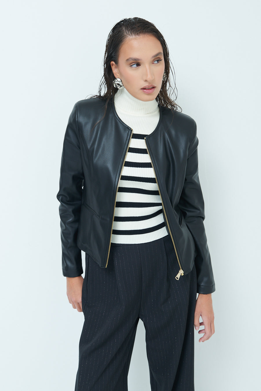 Woman  in Sleek zip-up black leather jacket