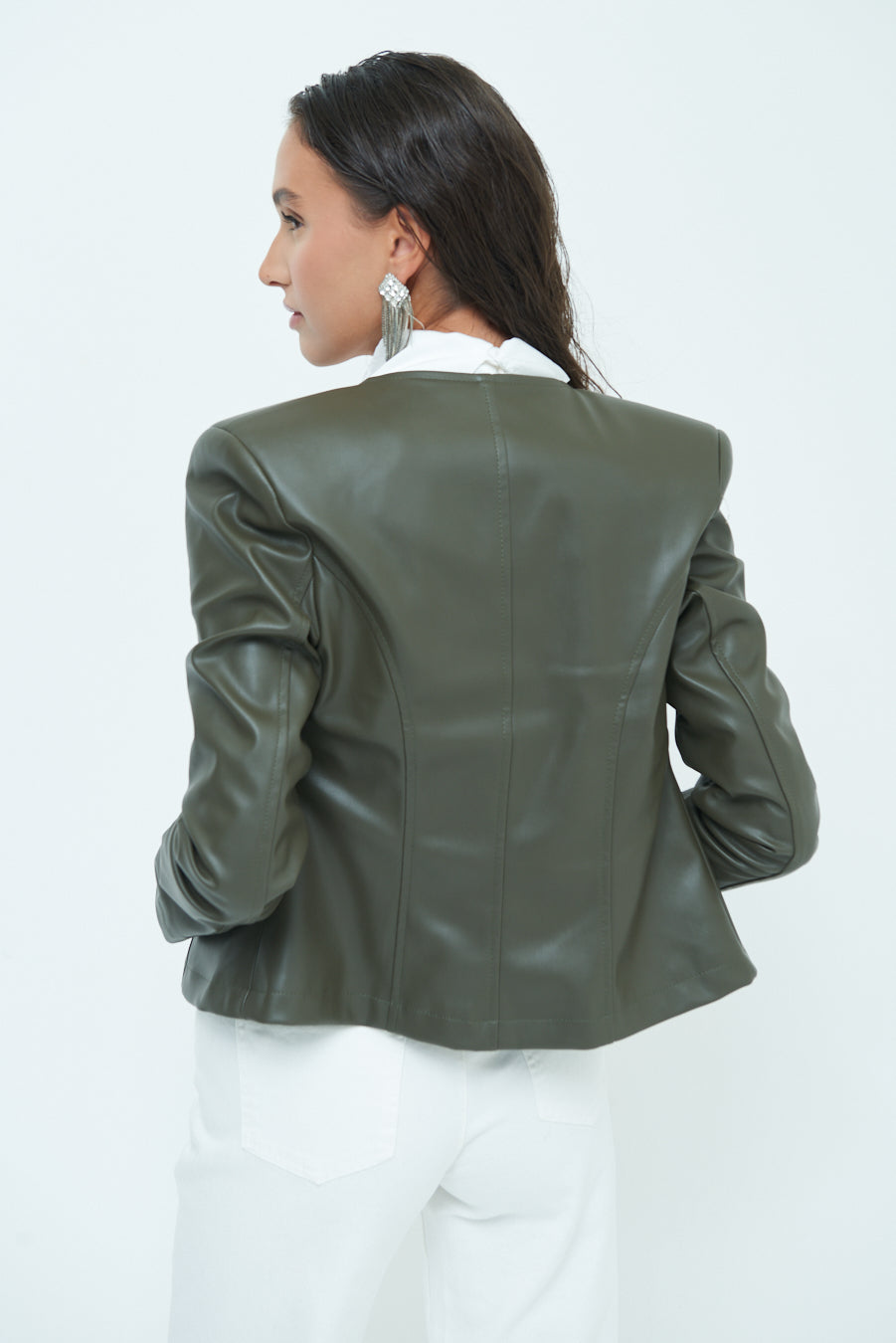 Woman  in Sleek zip-up green leather jacket